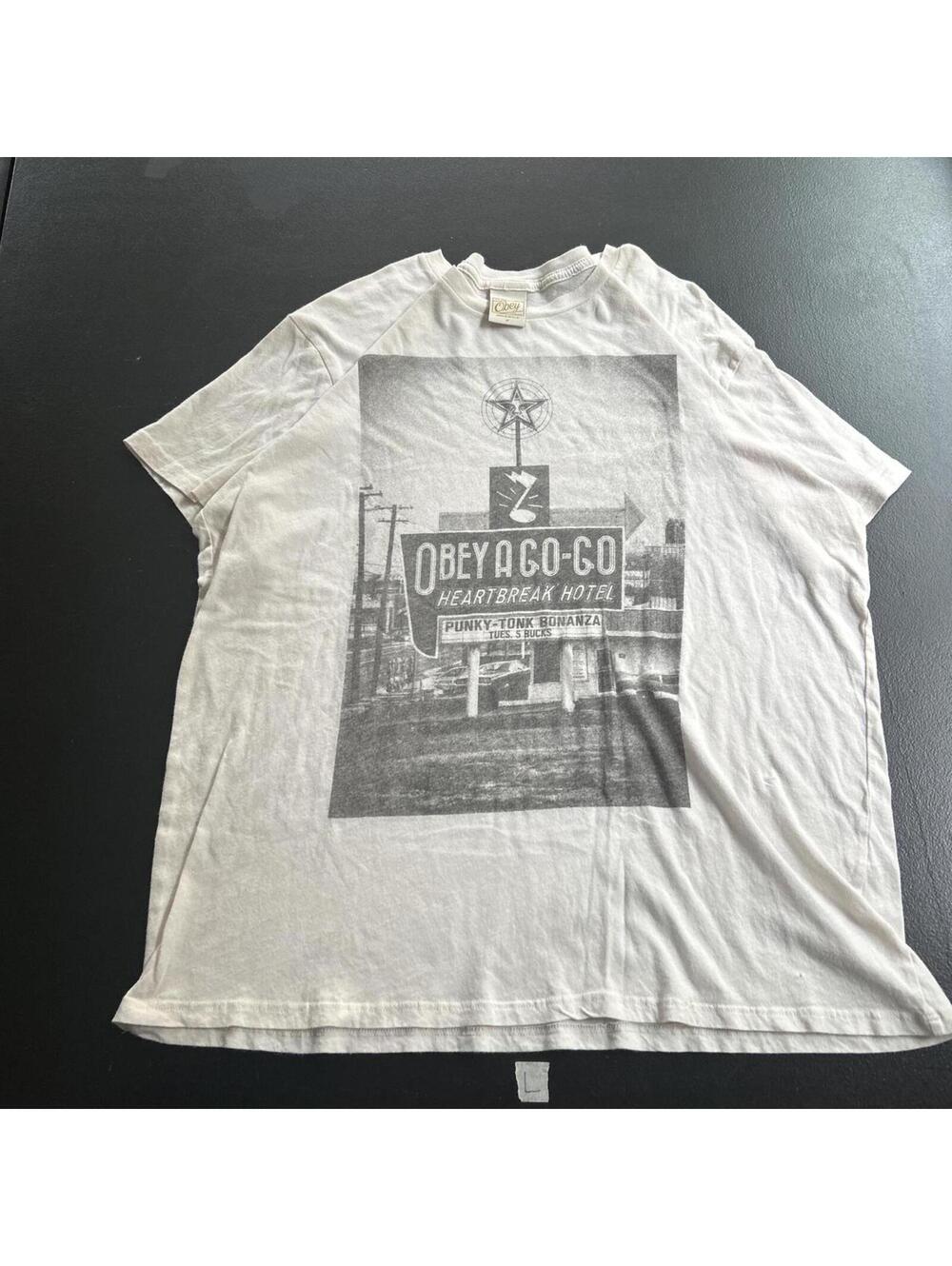 Vintage Obey propaganda streetwear graphic tee in an off-white/cream colorway.
